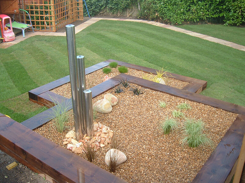 Water feature in raised bed garden in Chester