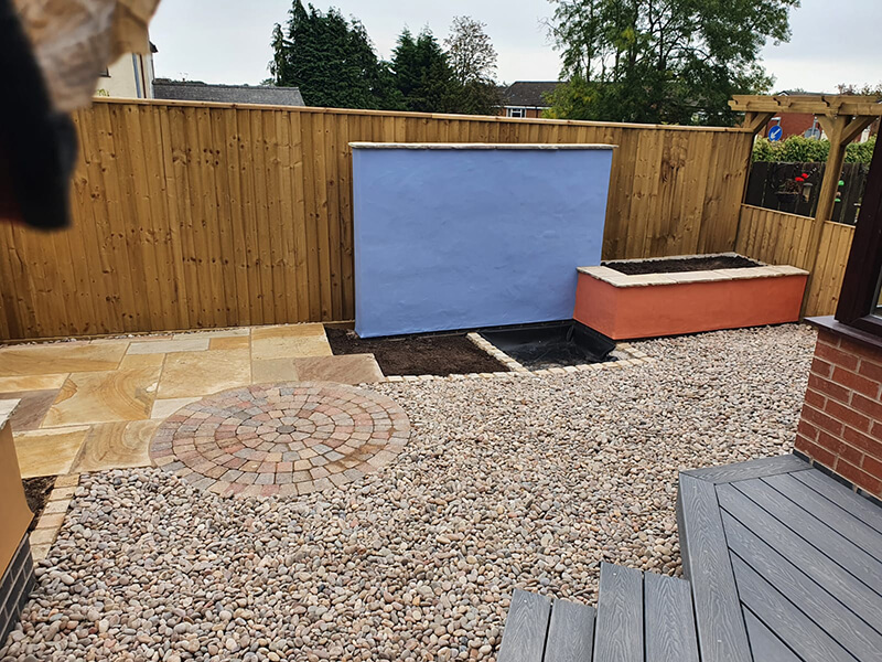 Outdoor living area with water feature in Wrexham