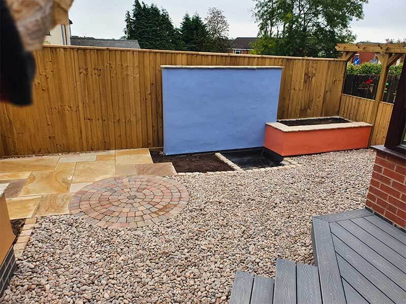 Outdoor living area with water feature in Wrexham
